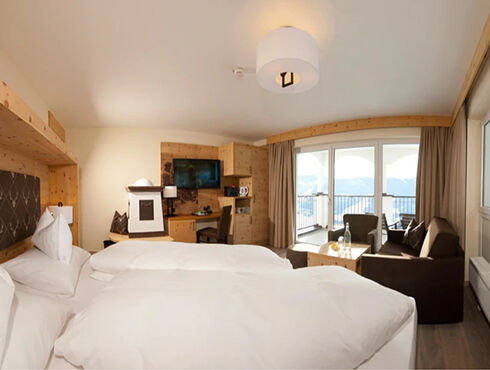 Swiss stone pine suite in modern alpine chic and panoramic view from the balcony