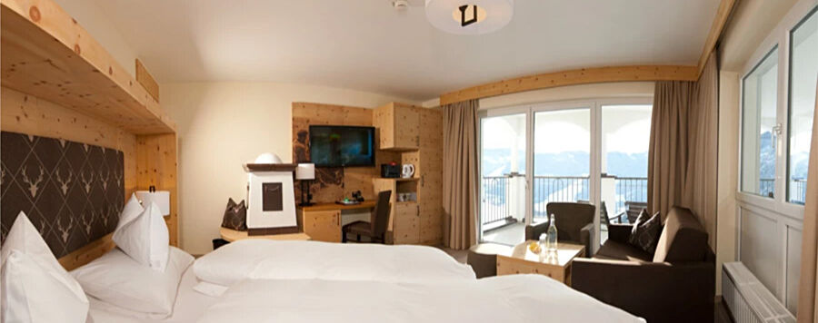 Swiss stone pine suite in modern alpine chic and panoramic view from the balcony