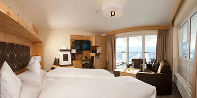 Swiss stone pine suite in modern alpine chic and panoramic view from the balcony