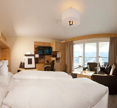 Swiss stone pine suite in modern alpine chic and panoramic view from the balcony
