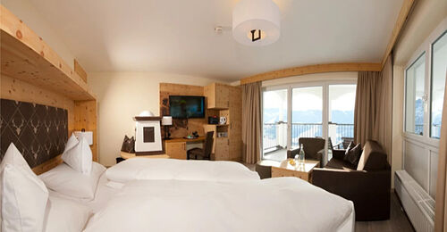 Swiss stone pine suite in modern alpine chic and panoramic view from the balcony