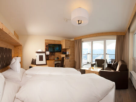 Swiss stone pine suite in modern alpine chic and panoramic view from the balcony