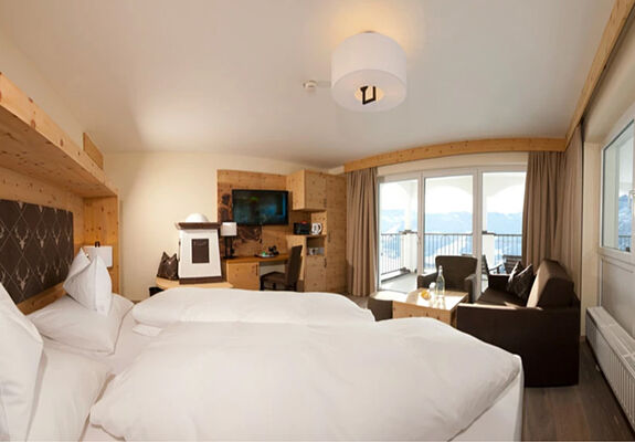 Swiss stone pine suite in modern alpine chic and panoramic view from the balcony