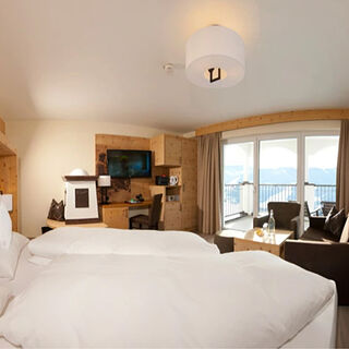 Swiss stone pine suite in modern alpine chic and panoramic view from the balcony