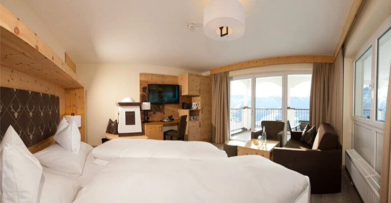 Swiss stone pine suite in modern alpine chic and panoramic view from the balcony